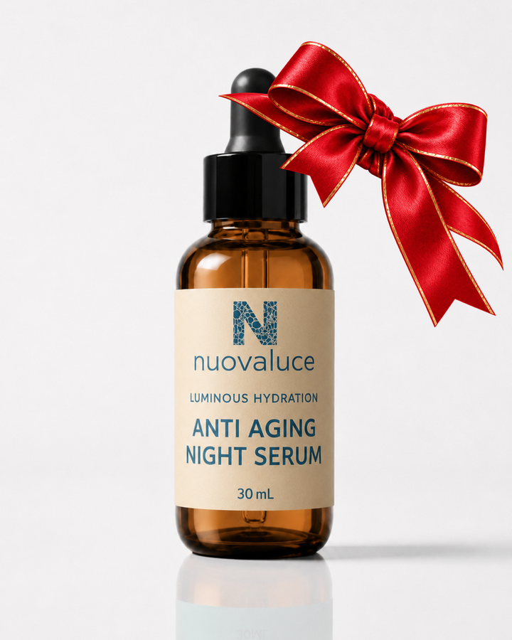 Luminous Hydration Anti Aging Night Serum with red and gold holiday bow