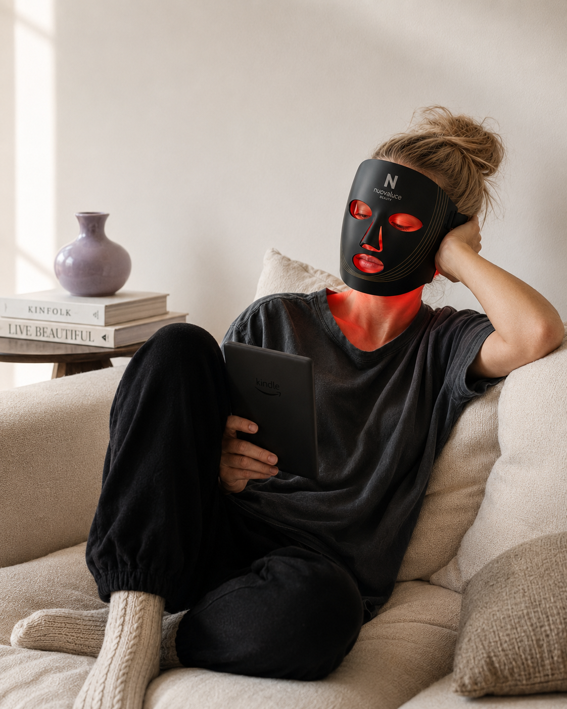 Nuovaluce LED light therapy mask used during a cozy at-home skincare routine